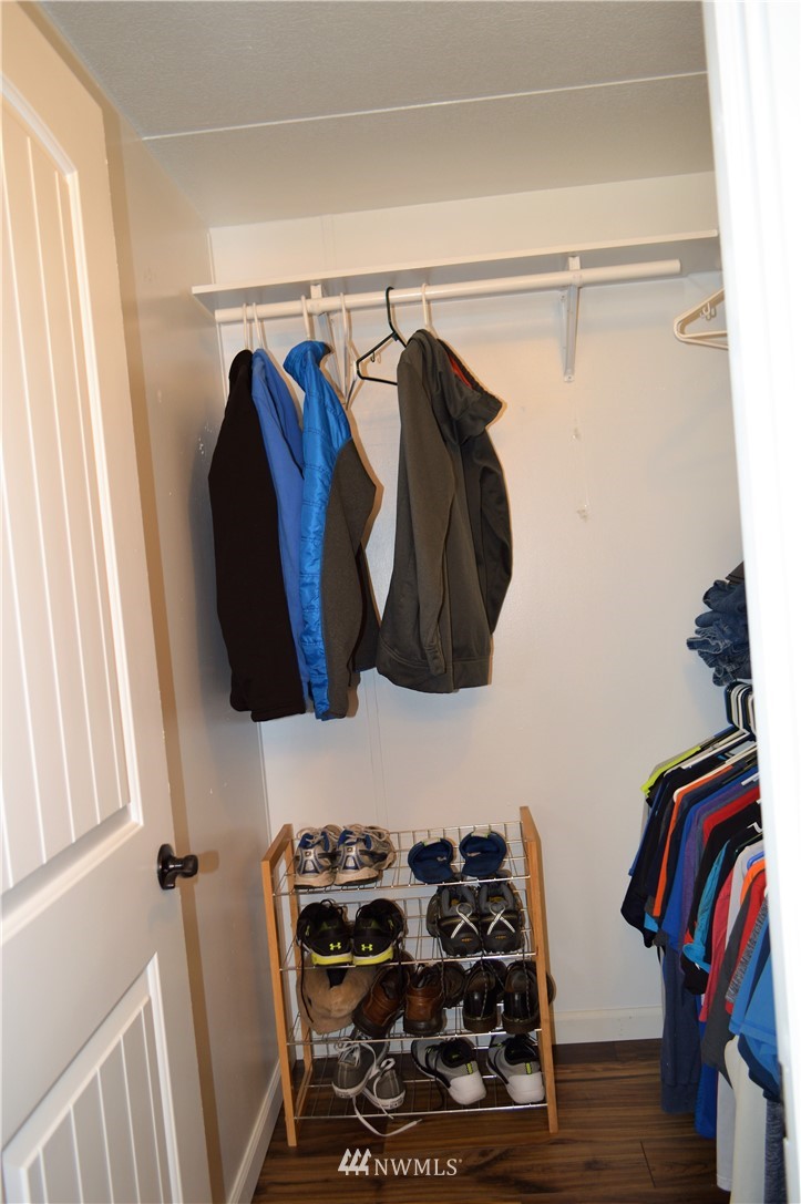 19129 Loganberry Street Southwest Rochester, WA 98579 - Photo 15 of 25 a view of walk in closet with clothes and shoes