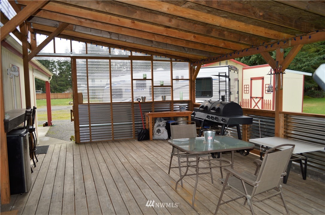 19129 Loganberry Street Southwest Rochester, WA 98579 - Photo 19 of 25 a view of a patio with table and chairs
