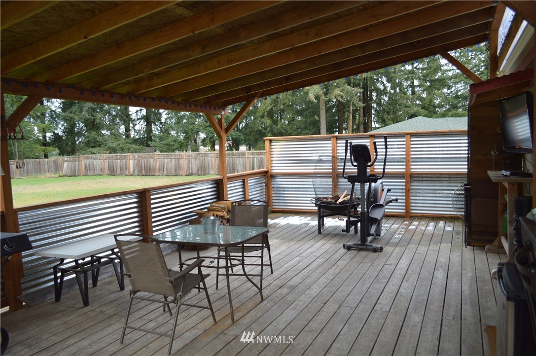 19129 Loganberry Street Southwest Rochester, WA 98579 - Photo 21 of 25 a view of a chairs and table on the deck