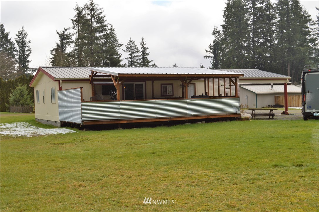 19129 Loganberry Street Southwest Rochester, WA 98579 - Photo 23 of 25 a front view of a house with swimming pool