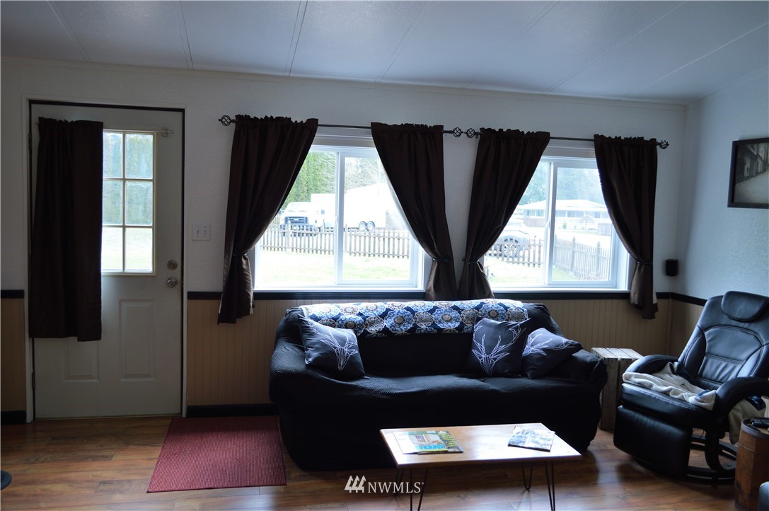 19129 Loganberry Street Southwest Rochester, WA 98579 - Photo 6 of 25 a living room with furniture and a window