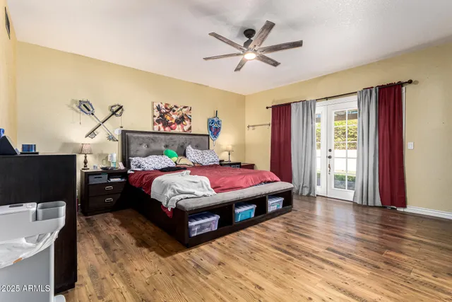 a bedroom with a bed and a dresser