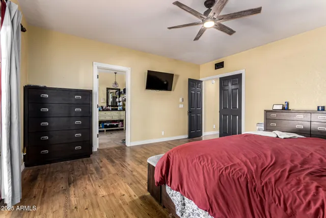 a living room with stainless steel appliances kitchen island granite countertop a refrigerator and a stove