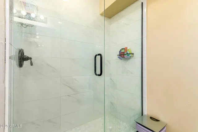 a living room with a couch and a chandelier