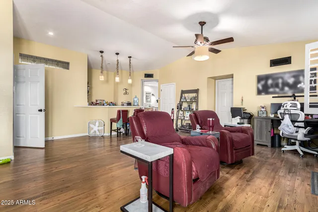 a view of kitchen and dining room with furniture window and wooden floor