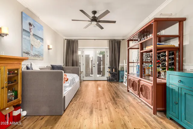a view of a hallway with wooden floor and furniture