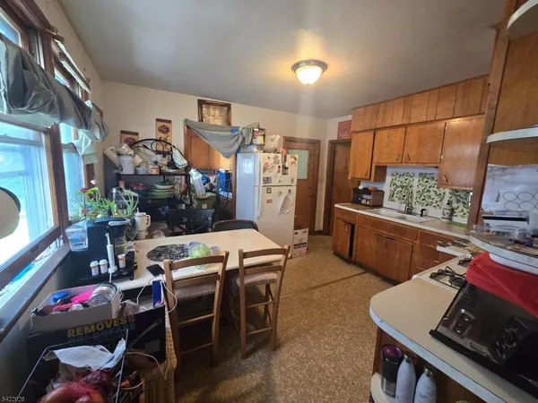 a room with furniture a flat screen tv and a table