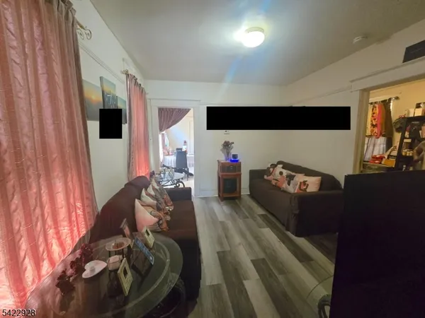 a bed room with a bed and a television