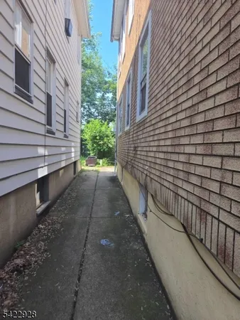 a view of a pathway with a building in the background