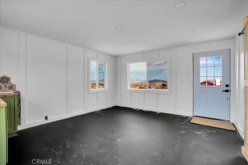 777 Quail Bush Road Landers, CA 92285 - Photo 9 of 46 an empty room with windows