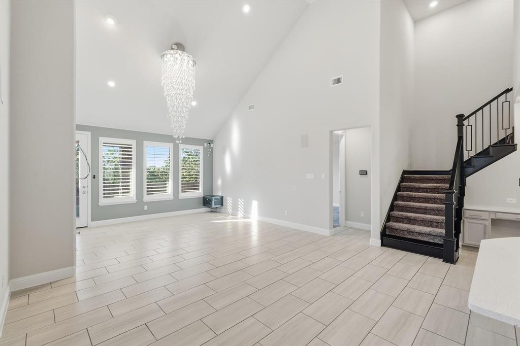 2114 Stanhill Drive Corinth, TX 76210 - Photo 11 of 40 wooden floor in an empty room with a window