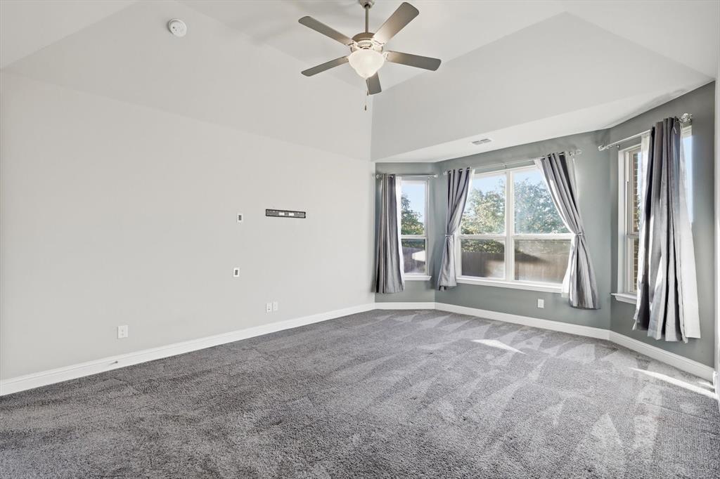 2114 Stanhill Drive Corinth, TX 76210 - Photo 17 of 40 a view of an empty room with a window