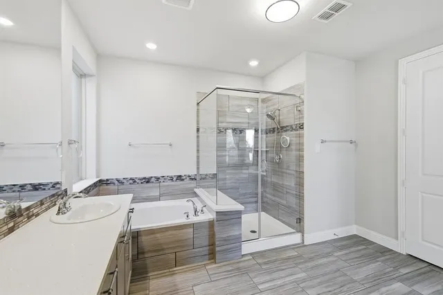 a bathroom with a sink a mirror and a bathtub