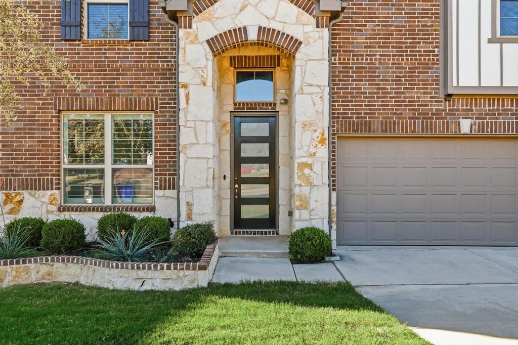 2114 Stanhill Drive Corinth, TX 76210 - Photo 2 of 40 a front view of a house with a yard