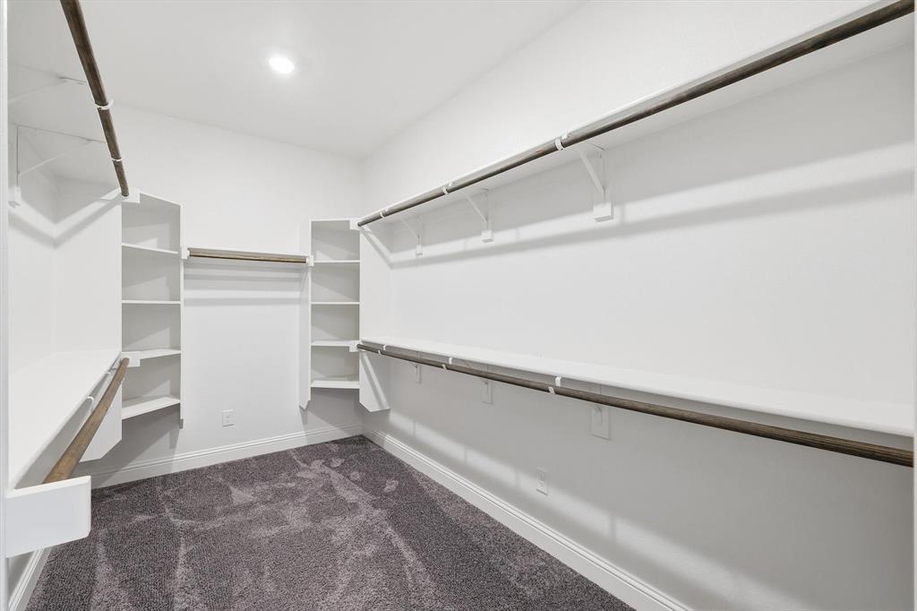 2114 Stanhill Drive Corinth, TX 76210 - Photo 21 of 40 a view of an empty walk in closet