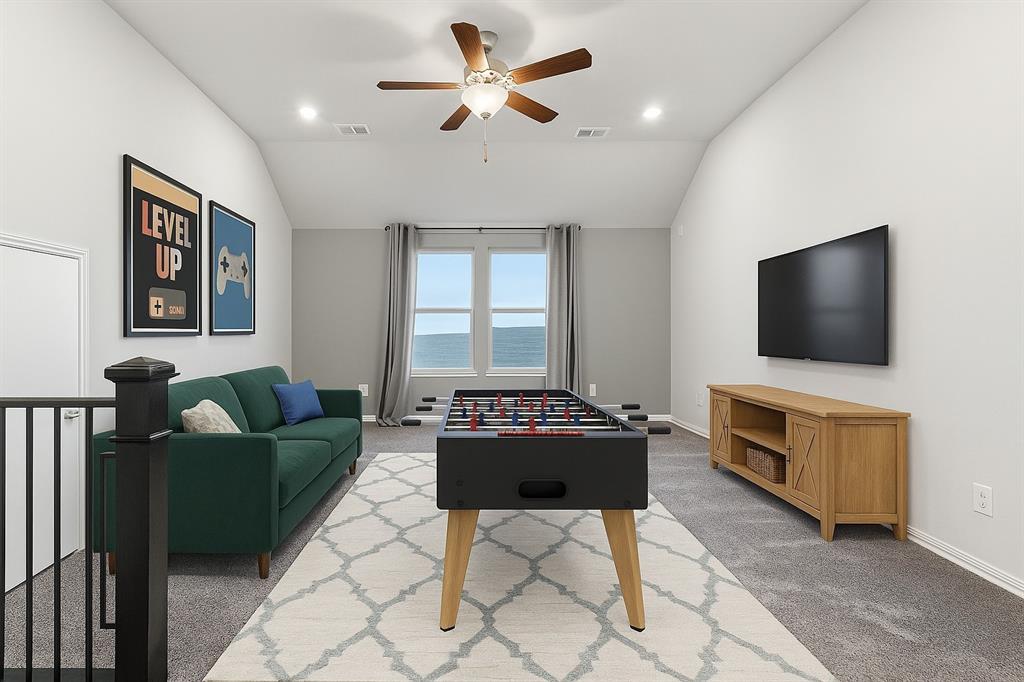 2114 Stanhill Drive Corinth, TX 76210 - Photo 22 of 40 a living room with furniture and a flat screen tv