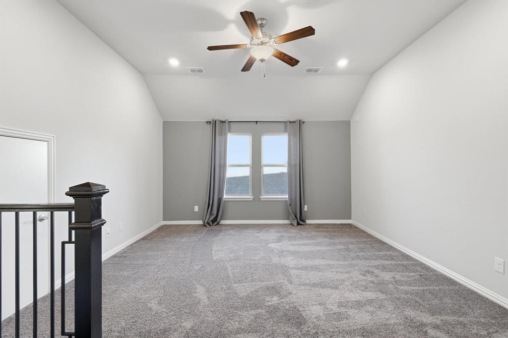 2114 Stanhill Drive Corinth, TX 76210 - Photo 23 of 40 a view of an empty room with a window
