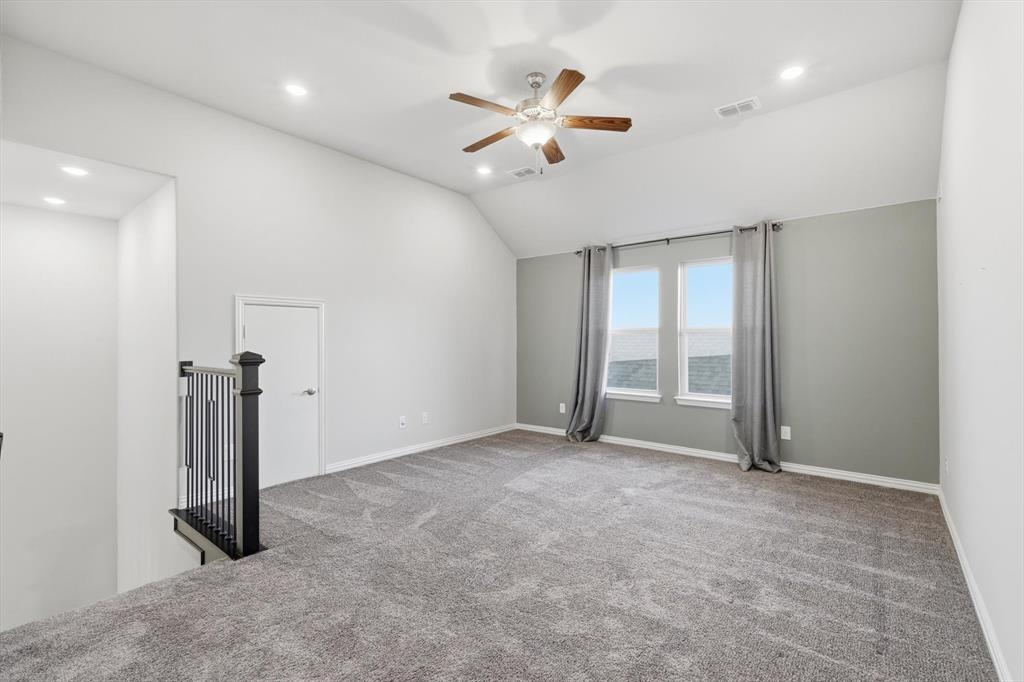 2114 Stanhill Drive Corinth, TX 76210 - Photo 24 of 40 wooden floor in an empty room with a ceiling fan