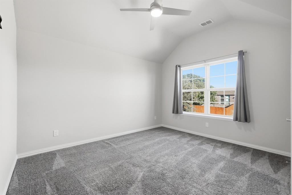 2114 Stanhill Drive Corinth, TX 76210 - Photo 27 of 40 an empty room with window
