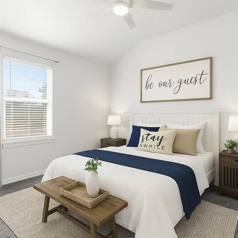 a bedroom with a bed and a table in it