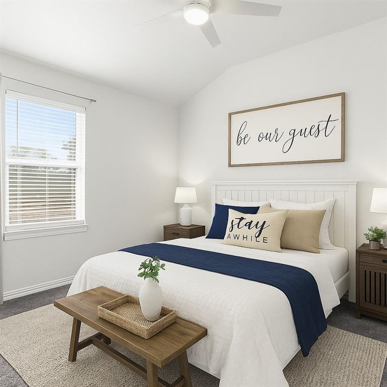 2114 Stanhill Drive Corinth, TX 76210 - Photo 29 of 40 a bedroom with a bed and a table in it