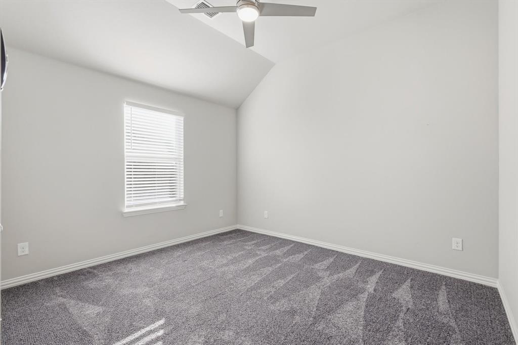 2114 Stanhill Drive Corinth, TX 76210 - Photo 30 of 40 an empty room with a window