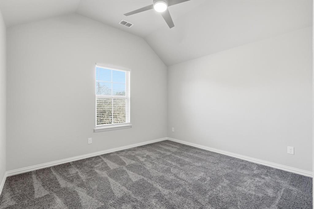 2114 Stanhill Drive Corinth, TX 76210 - Photo 32 of 40 an empty room with a window