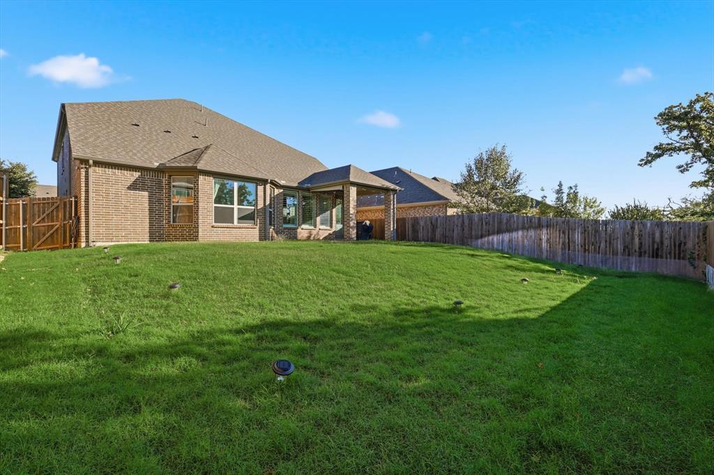 2114 Stanhill Drive Corinth, TX 76210 - Photo 38 of 40 a front view of a house with a yard