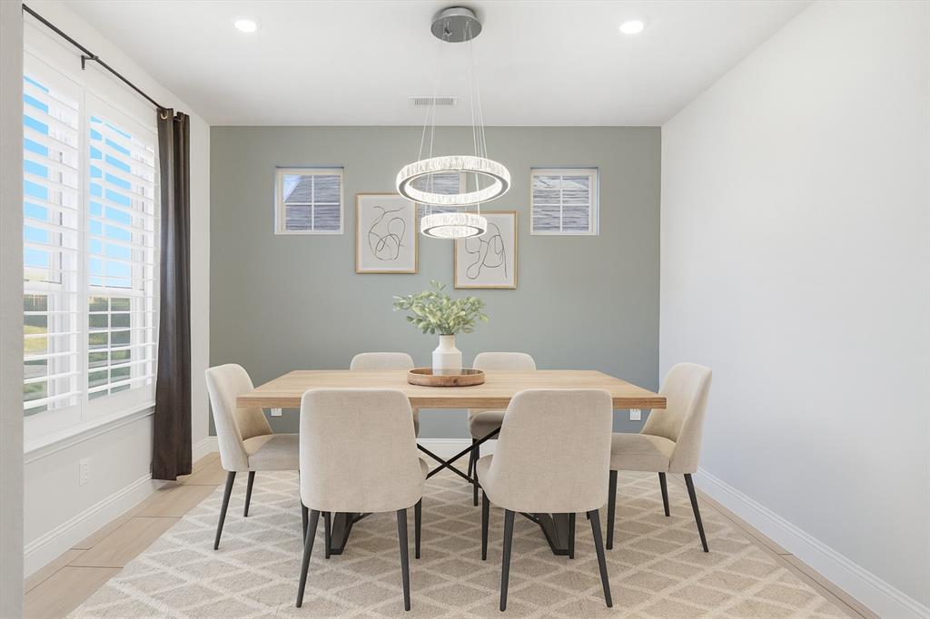 2114 Stanhill Drive Corinth, TX 76210 - Photo 4 of 40 a view of a dining room with furniture and wooden floor