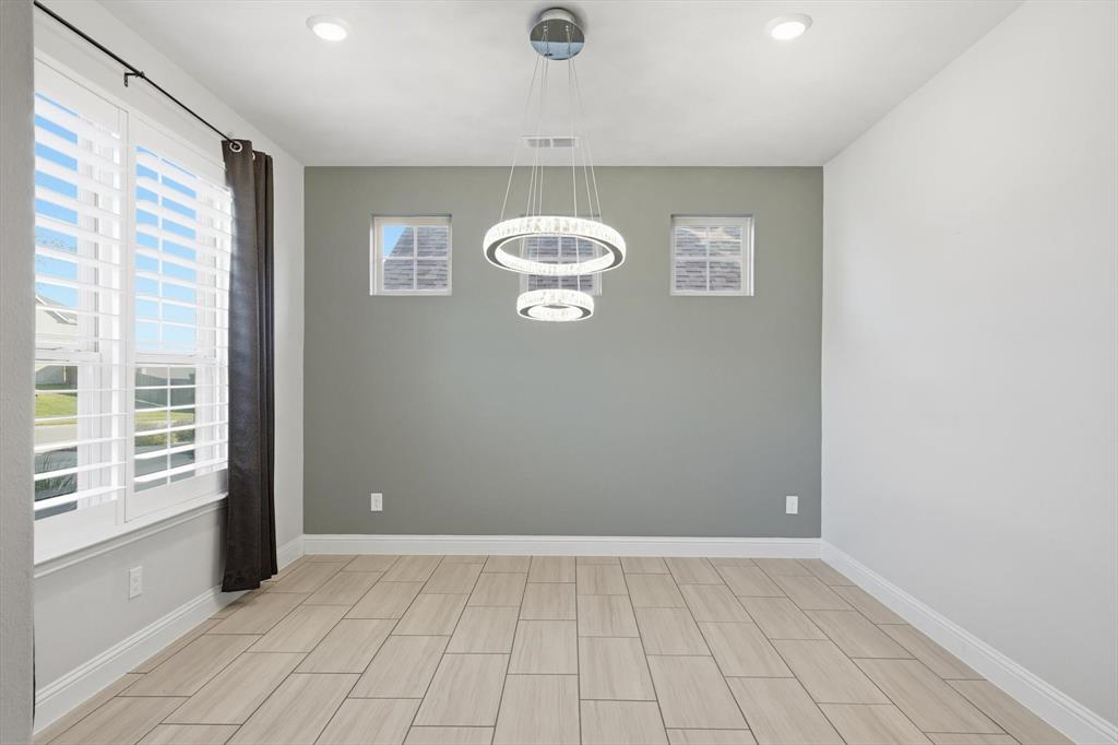 2114 Stanhill Drive Corinth, TX 76210 - Photo 5 of 40 a view of an empty room with a window