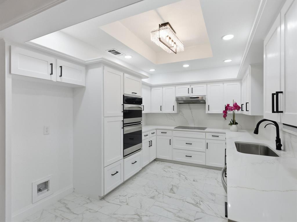 1202 High Ridge Drive Duncanville, TX 75137 - Photo 13 of 28 a kitchen with granite countertop a white stove top oven and sink
