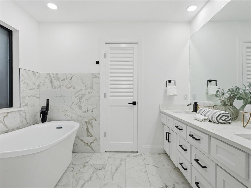 1202 High Ridge Drive Duncanville, TX 75137 - Photo 21 of 28 a bathroom with a granite countertop sink mirror and bathtub