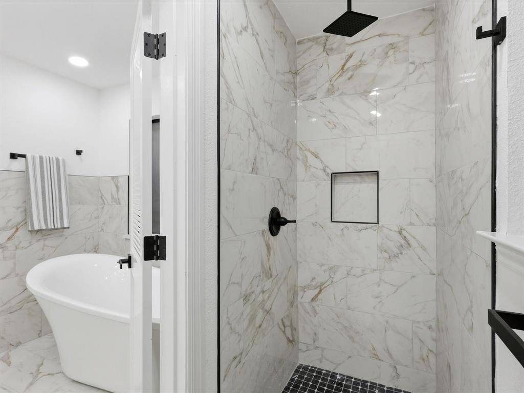 1202 High Ridge Drive Duncanville, TX 75137 - Photo 24 of 28 a bathroom with a bathtub and a shower