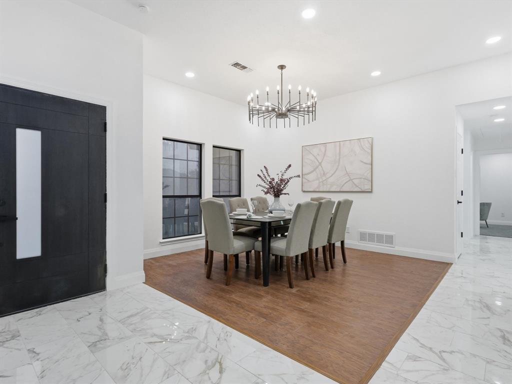 1202 High Ridge Drive Duncanville, TX 75137 - Photo 6 of 28 a view of a dining room with furniture and chandelier