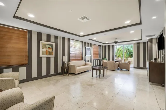 a view of a hallway with furniture and entryway