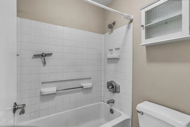 a bathroom with a shower and a bathtub