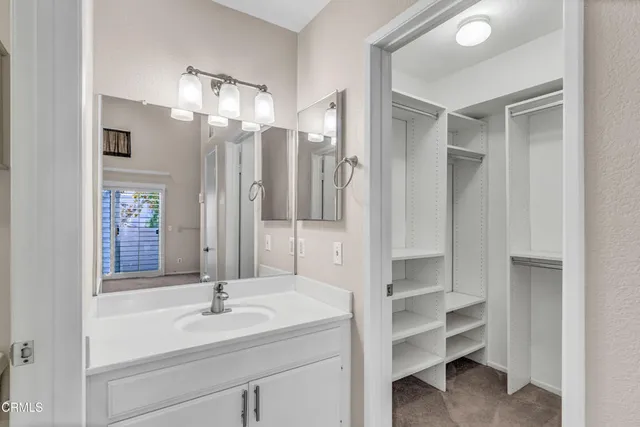 a bathroom with a sink double vanity and a mirror