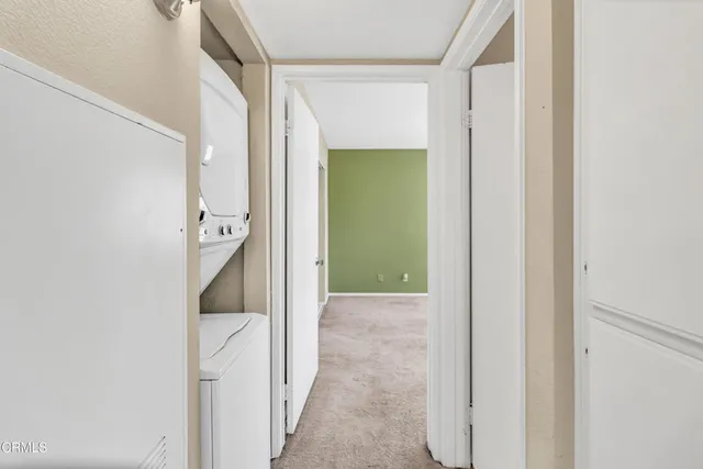 a view of a bathroom from a hallway