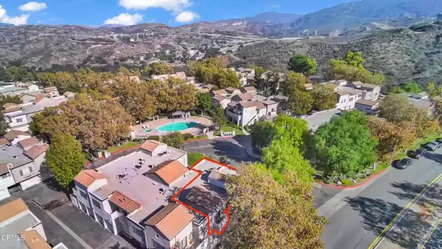 an aerial view of residential houses with outdoor space