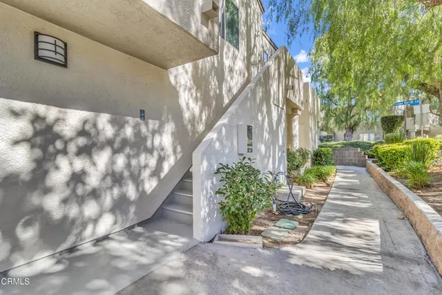 a view of a pathway with a yard