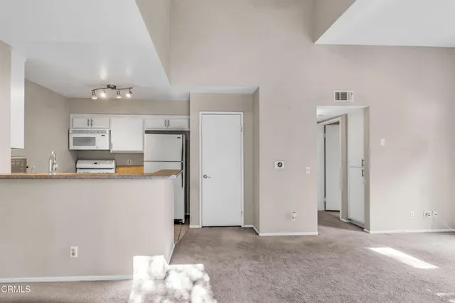 a view of a kitchen with a sink