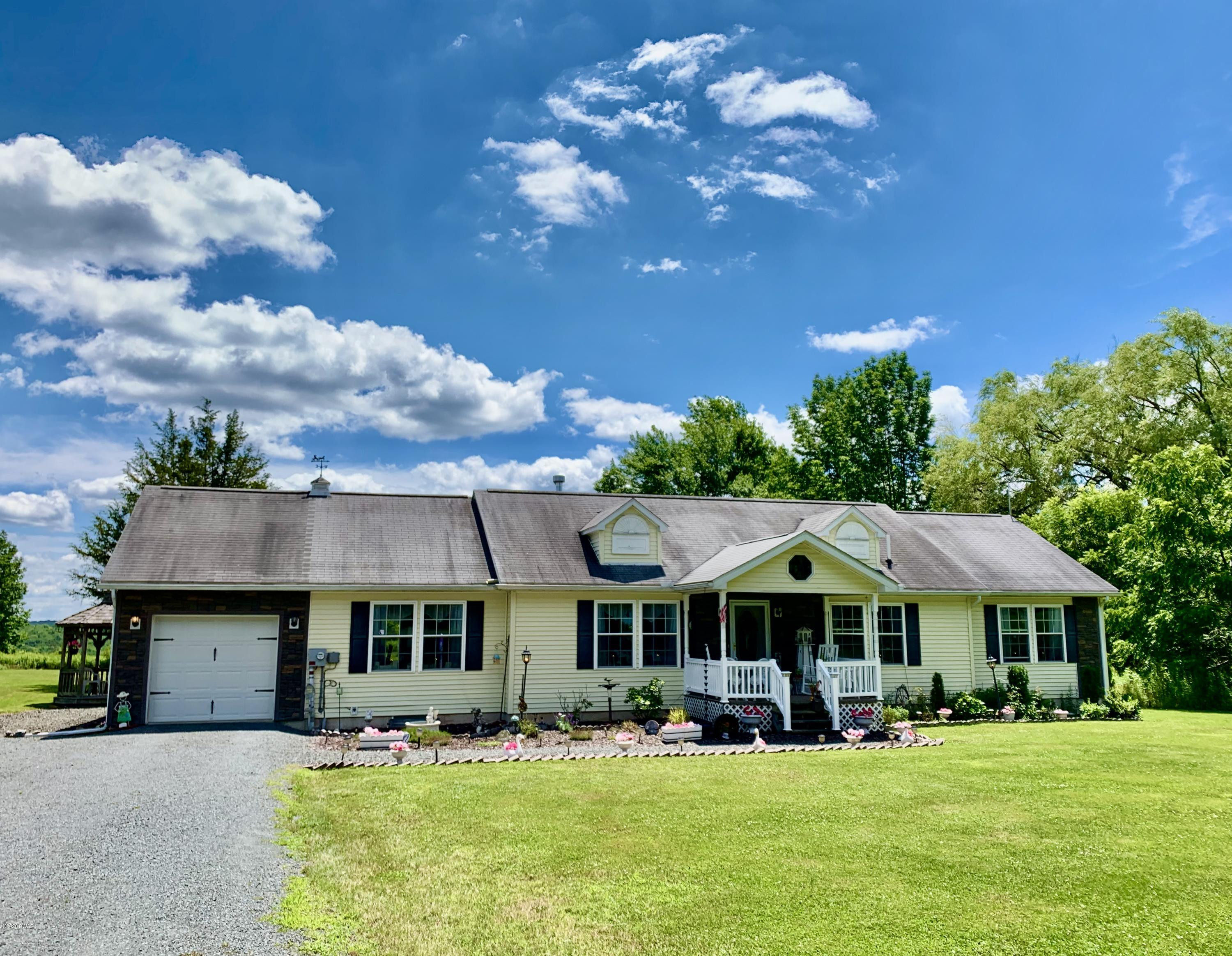 678 Stock Farm Road Lake Ariel, PA 18436 - Photo 2 of 41 a front view of a house with garden