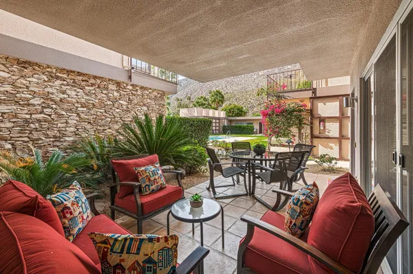 a outdoor living space with furniture and a potted plant