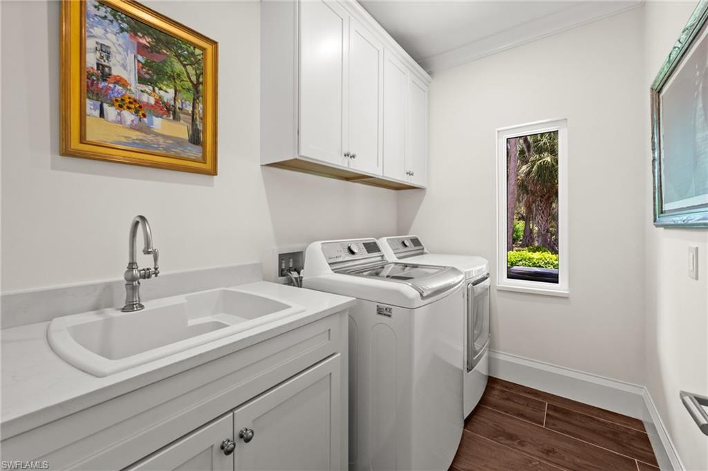 2003 Duke Drive Naples, FL 34110 - Photo 28 of 45 Laundry room with built-in cabinetry, utility sink, and added storage