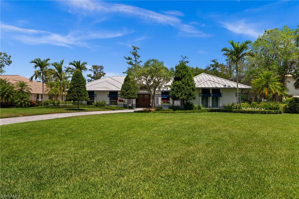 2003 Duke Drive Naples, FL 34110 - Photo 36 of 45 a view of a house with a yard