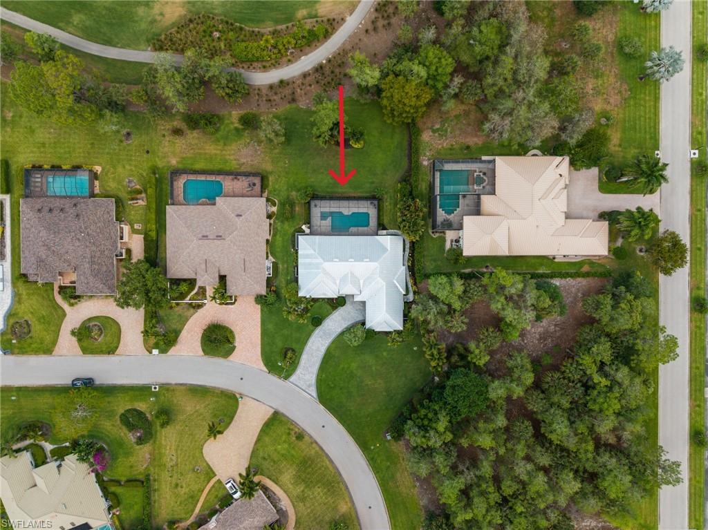 2003 Duke Drive Naples, FL 34110 - Photo 38 of 45 an aerial view of a house with a swimming pool