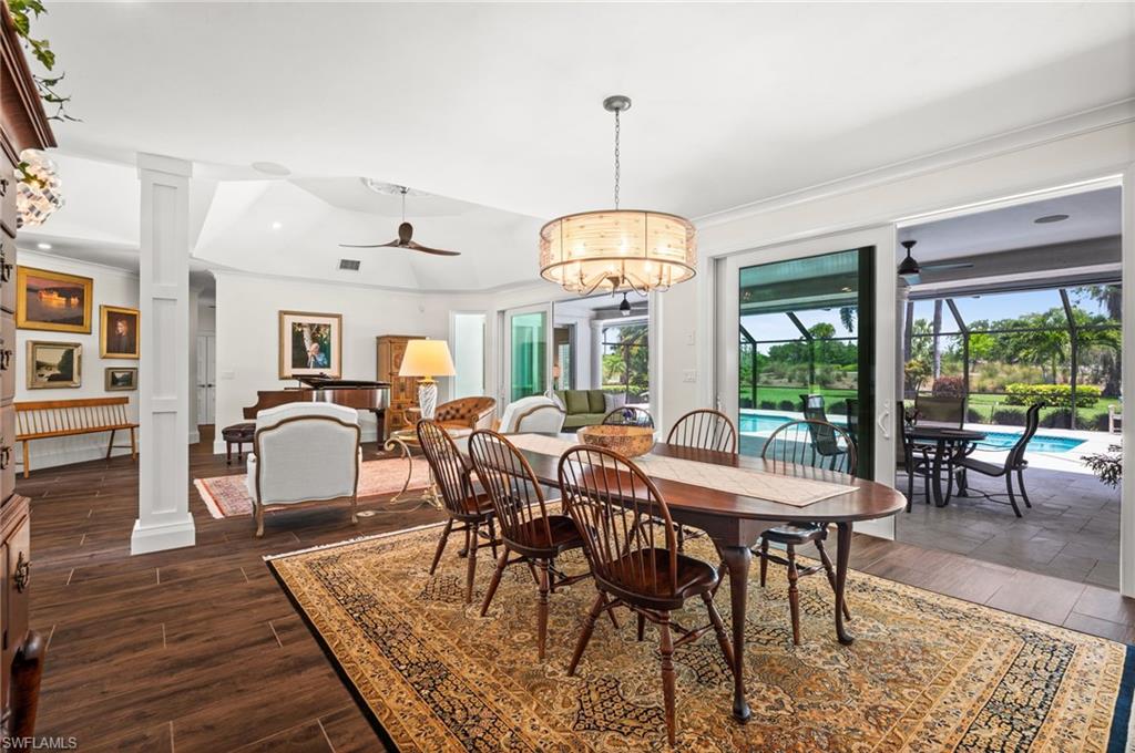 2003 Duke Drive Naples, FL 34110 - Photo 5 of 45 Formal dining area with elegant lighting.