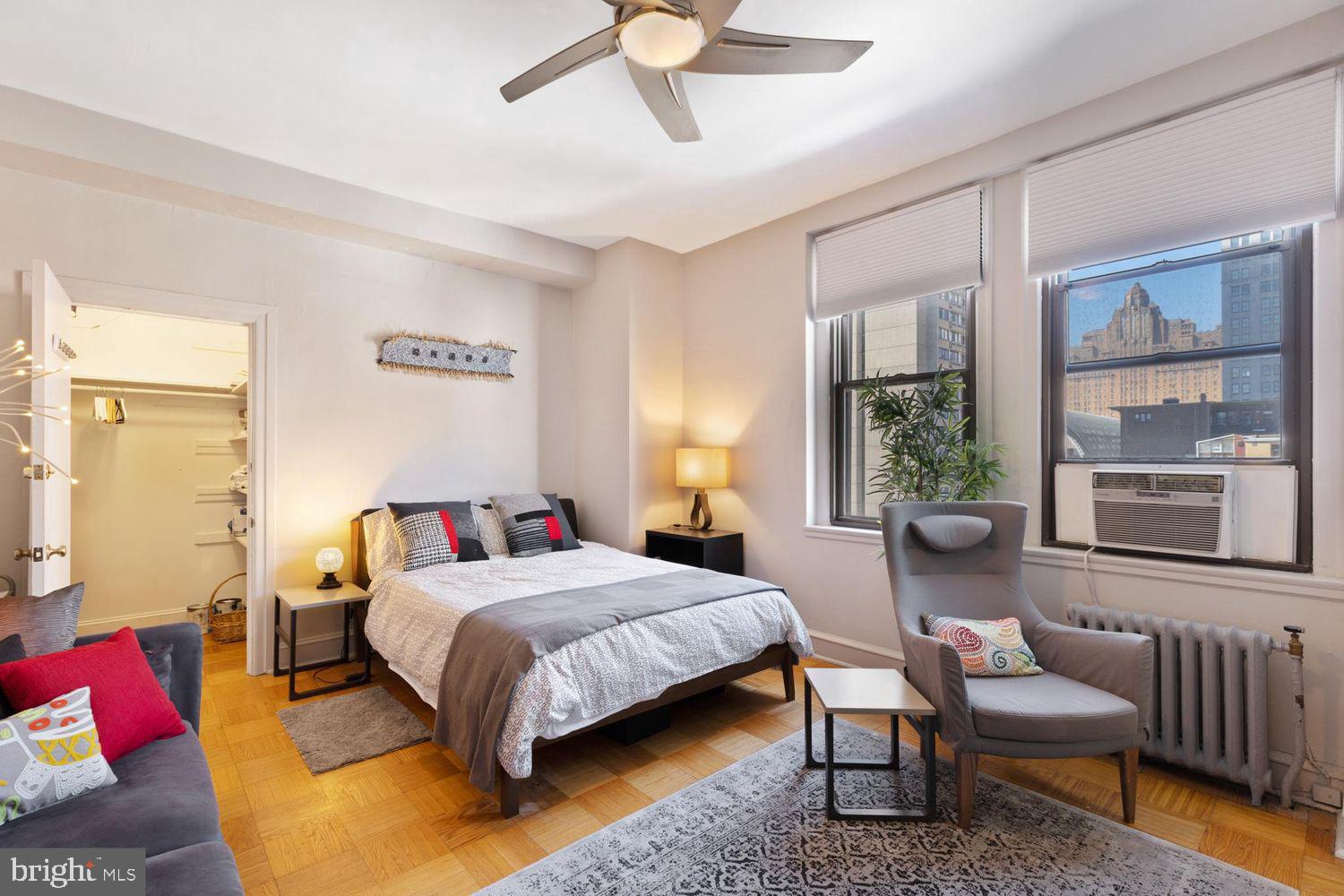 a bedroom with a bed and window