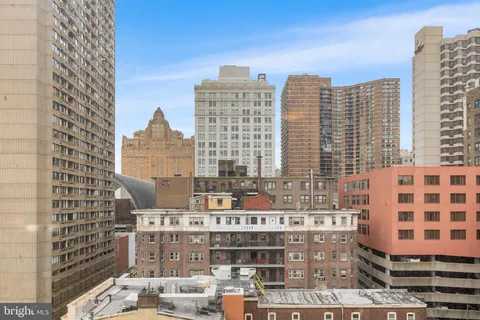 a view of a city with tall buildings