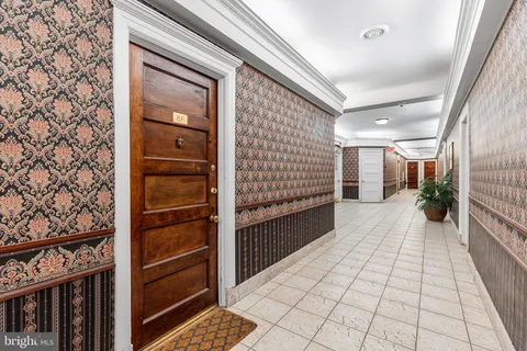 a view of a house with a door and wooden floor